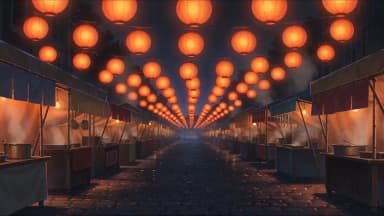 The Dusk Market at night, lanterns strung the length of the aisle